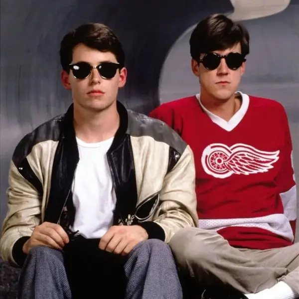 Ferris Bueller standing on a parade float