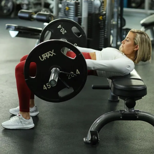 Gym hip thrust with barbell and bench