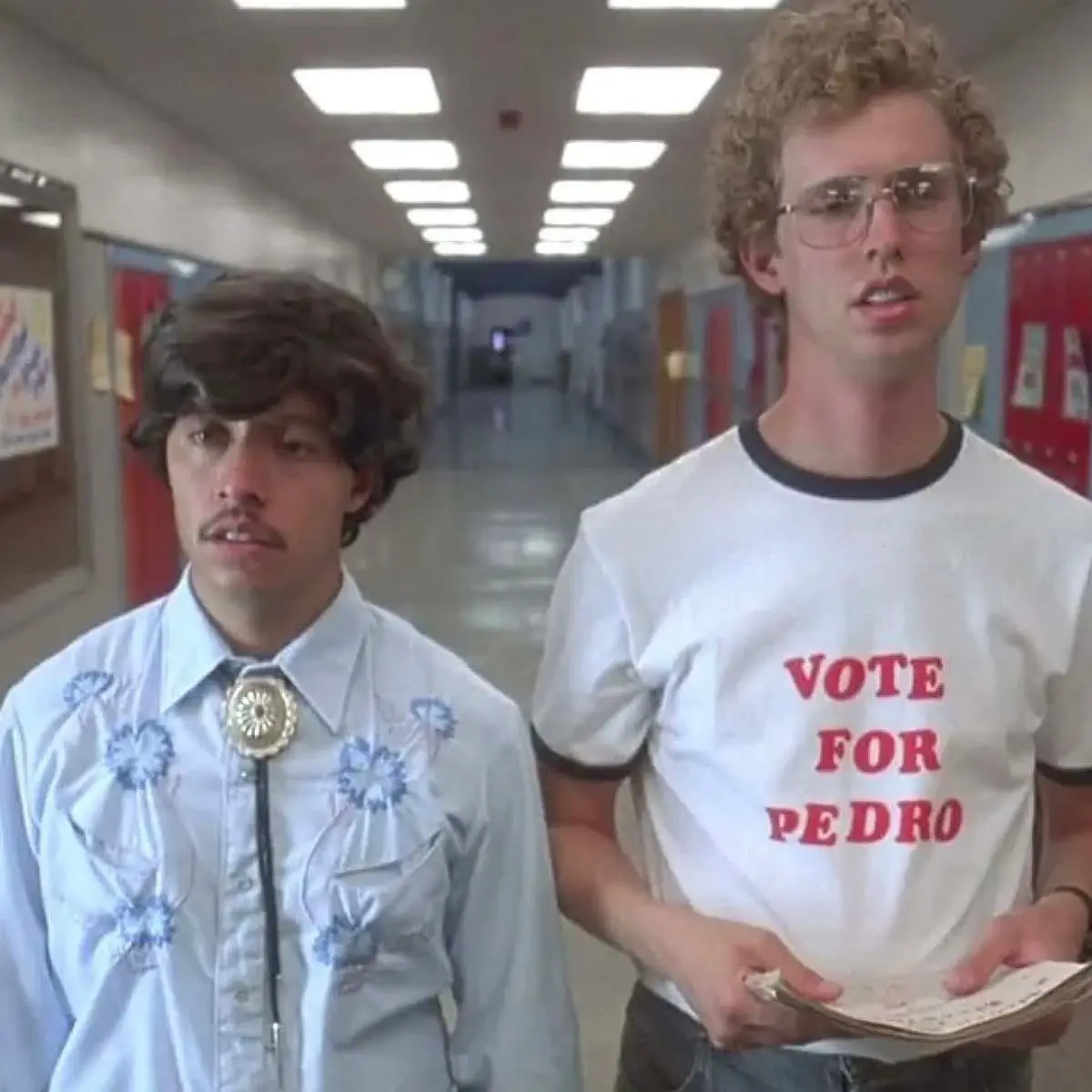 Napoleon Dynamite standing in front of a school locker