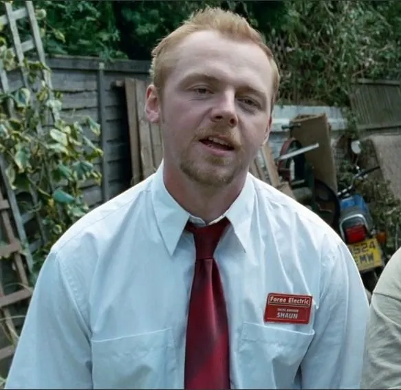 Shaun and Ed holding cricket bat and shovel